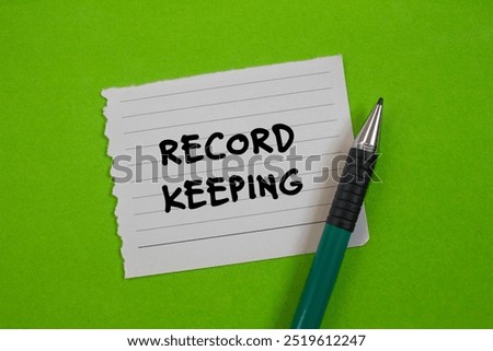 Record keeping message written on ripped torn paper with a pen on green background. Conceptual record keeping symbol. Copy space.