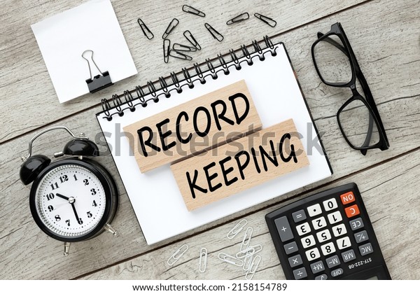 record keeping text on wooden blocks. business\
concept. education\
concept.