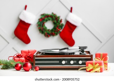 Record Player And Christmas Decor On Table