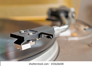 record player stylus on a rotating disc - Shutterstock ID 155626658