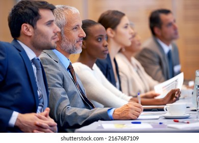 Recording the facts. Shot of a group of people sitting in a conference. - Powered by Shutterstock