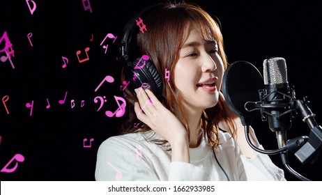 Recording of song concept. Young female asian singer. - Powered by Shutterstock