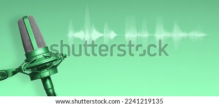 Recording studio microphone with audio waveform on green background. Podcast or radio broadcast banner with copy space