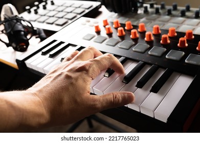 Recording Studio. Professional Studio Equipment. Musician's Hand On Midi Keyboard. Close-up. Work With Sound, Podcast, Recording Of Musical Works, Arrangement. Musician, Composer, Sound Engineer.