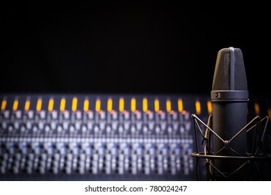 Recording Studio Scene With Close Up On Mic And Soft Focus On Mixer. Negative Space Available For Copy, Logo Etc.