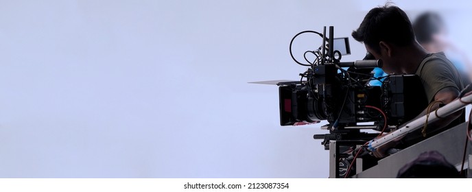 Recording video at studio. Camera records or filming for professional bloggers. Behind the scenes of filming video production. film crew on the set in film studio. Backstage video production recording - Shutterstock ID 2123087354