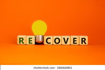 Recover Concept. Wooden Cubes With Word 'recover'. Yellow Light Bulb. Beautiful Orange Background. Business And Recover Concept. Copy Space.