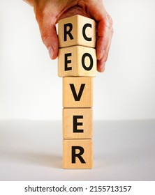 Recover Symbol. Concept Word 'recover' On Wooden Cubes On A Beautiful White Table. Businessman Hand. White Background. Business And Recover Concept. Copy Space.