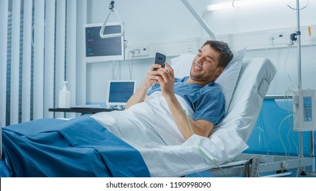 Recovering Patient Uses Smartphone while Lying on a Bed in the Hospital. - Powered by Shutterstock