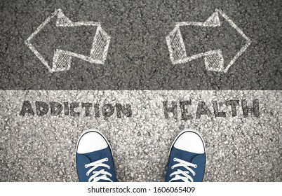 Recovery Concept, Addiction Or Health Written On The Asphalt Road. Above View Of Feet On The Ground