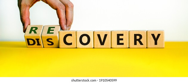 Recovery or discovery symbol. Businessman turns wooden cubes, changes a word 'discovery' to 'recovery'. Beautiful white background. Business and discovery or recovery concept. Copy space.