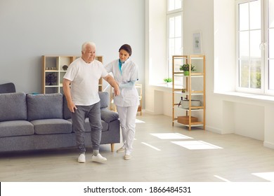 Recovery is easier with the right support. Friendly nurse helps an elderly patient walk around the room in a nursing home holding his hand. Concept of medical care and nursing. - Powered by Shutterstock