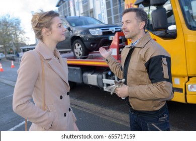 Recovery Man With Customer's Car On His Lorry