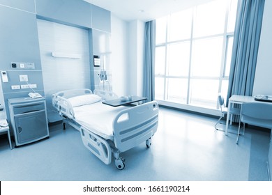 Recovery Room With Beds And Comfortable Medical. Interior Of An Empty Hospital Room. Clean And Empty Room With A Bed In The New Medical Center