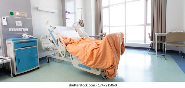 Recovery Room With Beds And Comfortable Medical. Interior Of An Empty Hospital Room. Clean And Empty Room With A Bed In The New Medical Center