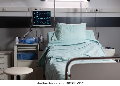 Recovery Room with beds and comfortable medical equipped in a hospital. Clean and empty room with a bed in the new medical center. Iv drip and in modern clinic. - Shutterstock ID 1990587311