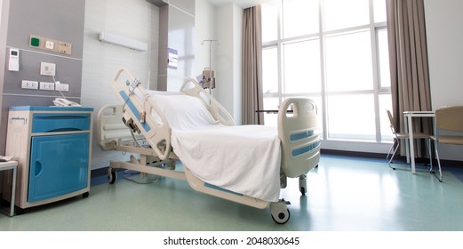 Recovery Room With Beds And Comfortable Medical. Interior Of An Empty Hospital Room. Clean And Empty Room With A Bed In The New Medical Center