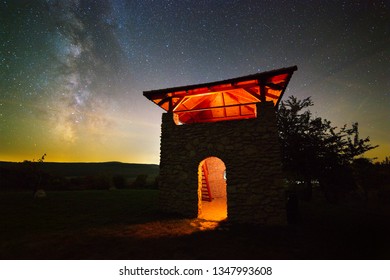 A Recreated Ancient Roman Watchtower Photographed On A Clear Night. The Milky Way Is Visible In The Background. The Structure Is Light Painted.