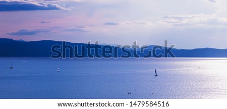 Recreational boating on Lake Champlain in Burlington, Vermont, USA at dusk. 
