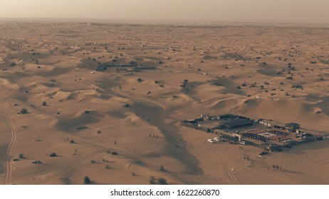 Recreational desert camps in the evening, UAE. Aerial view