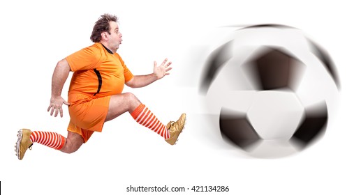 Recreational Fat Football Player Kicking The Ball Isolated On A White Background.  Fat  Man Soccer Player Running With Giant Ball 
