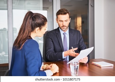 Recruiter Conducting Business Job Interview With Female Applicant In Office