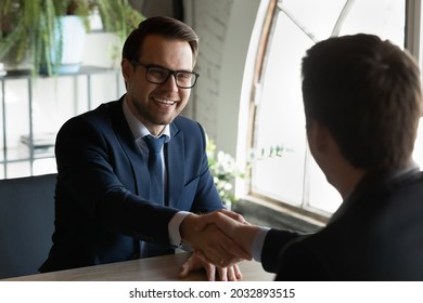 Recruiter Hr Manager Shaking Excited Candidate Hand, Greeting At Job Interview Or Congratulating, Hiring Process, Overjoyed Businessman In Glasses And Business Partner Handshake, Making Great Deal