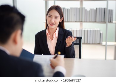 Recruiter interview young asian woman job candidate asking questions for a job interview. - Shutterstock ID 1908697327