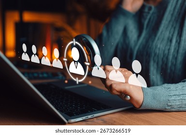 Recruitment and Candidate Selection Process Concept. HR Professional selects candidate from profile icons on laptop screen, symbolizing digital hiring, human resources, and recruitment technology.