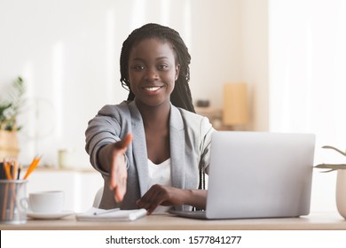 Recruitment Concept. Friendly Black Female HR Manager Extending Hand For Handshake At Camera After Successful Job Interview, Selective Focus.