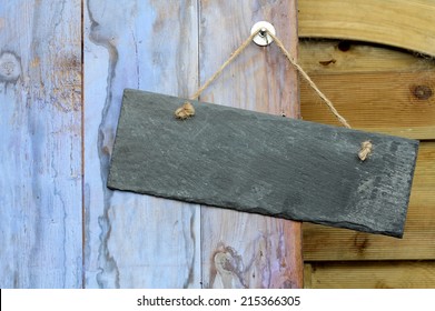 Rectangle Blank Slate Sign Hanging On A Garden Shed Door, Painted In Weathered  Blue Paint, 