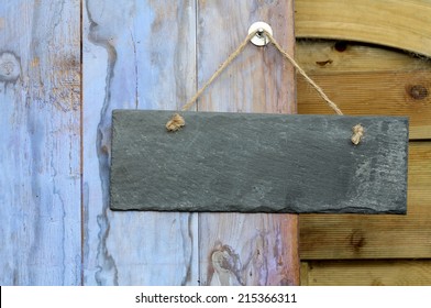 Rectangle Blank Slate Sign Hanging On A Garden Shed Door, Painted In Weathered  Blue Paint, 