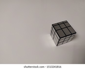 The rectangle cube is reflected on the surface