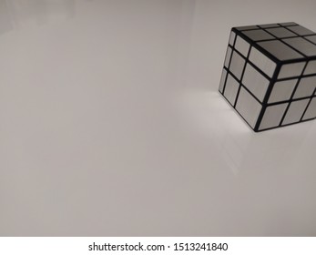 The rectangle cube is reflected on the surface