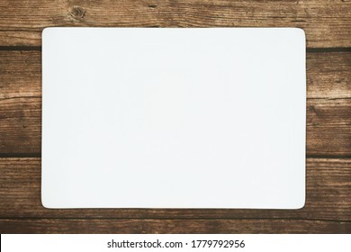 A Rectangle Empty White Plate On The Rustic Wooden Floor.