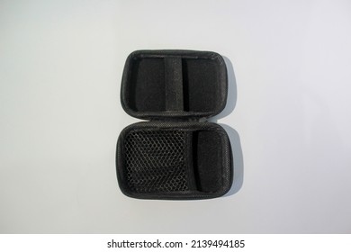 Rectangle holder case for charger and earphone isolated on white background.