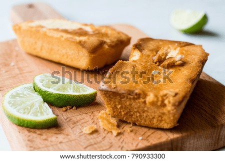 Rectangle Mini Lime Cakes on Wooden surface.