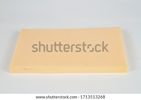 rectangle polyurethane yellow foam isolated on white background