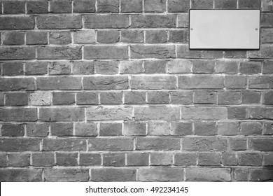 The rectangle type of traffic signage on brick wall for show caution and warning information.  