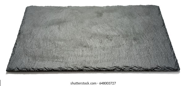 Rectangular black textured slate board for dishes isolated on white background, side angle view with perspective