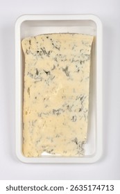 A rectangular block of Gorgonzola cheese, characterized by its creamy texture and distinctive blue veins, is presented in clear plastic packaging