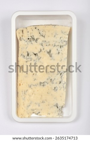 A rectangular block of Gorgonzola cheese, characterized by its creamy texture and distinctive blue veins, is presented in clear plastic packaging