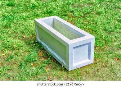 Rectangular Concrete Flower Bed For Flowers On The Grass