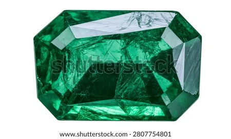 Rectangular emerald cut green gemstone with natural inclusions and facets