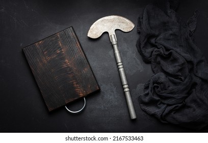 Rectangular Empty Wooden Cutting Board And Kitchen Knife On Black Table With Gauze Napkin, Top View