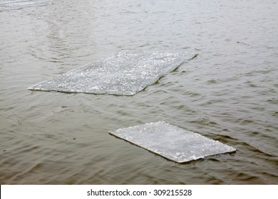 Rectangular ice floating on the water, closeup of photo