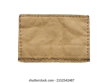 rectangular light brown leather nameplate on white background isolated from the leather lable of jeans