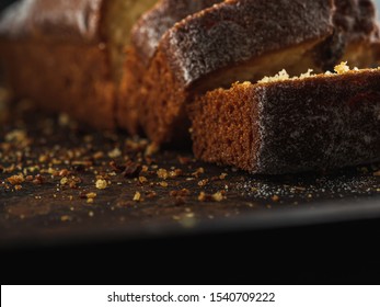 Rectangular loaf cut into pieces with a white sprinkle is on a rusty protvin. Horizontal orientation. close-up.