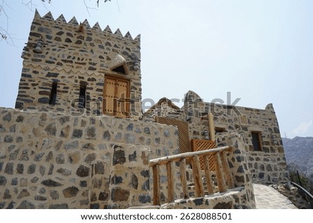 A rectangular parallelepiped tower house made of stone in the old village of Najd Al Miqsar. Najd Al Miqsar is a historical abandoned settlement west of Khor Fakkan in Sharjah, UAE.