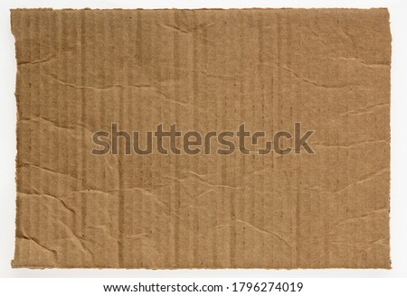 rectangular piece of corrugated brown cardboard isolated on white